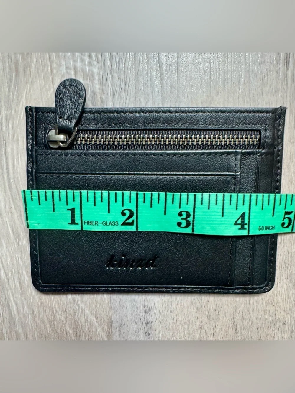 Kinzd minimalist leather card holder by Kinzd, featuring a zippered compartment